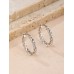 Stainless Steel Twist Mini Hoop Earrings in Silver